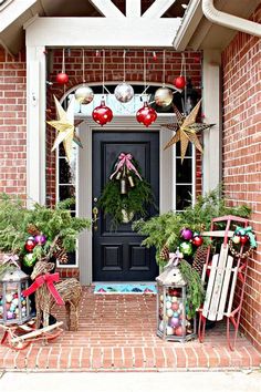 a front door decorated with christmas decorations and wreaths