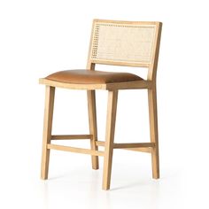 a wooden bar stool with leather seat padding and backrests on an isolated white background