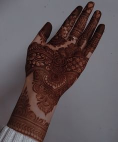 a henna on the palm of someone's hand