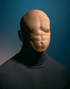 a man's head and torso is shown in front of a blue background