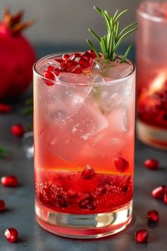 pomegranate and rosemary garnish in a glass with ice