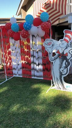 a dr seuss themed party with balloons and decorations