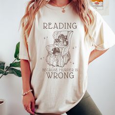 Get ready to be OBSESSED with your new reading shirt. It's the cutest and most trendy way to combine all those important trendy light academia and victorian aesthetic vibes! This is the perfect bookish shirt!  * Q U I C K * F A C T S * ✺  All shirts are UNISEX ✺  100%  ringspun cotton (fiber content may vary for different colors) ✺  Soft-washed, garment-dyed fabric brings extra coziness ✺  Wash and dry normally (on cool for best results) ✺  Sewn-in twill label * S I Z I N G * ✺ For an oversized fit, select two or three sizes up from your normal size ✺ Model is wearing size L  ✺ Sizing runs true to size ✺ Relaxed fit ✺ Most women find their typical size works best, since they are meant to fit a touch loose ✺ See Size guide and fit in images          * S H I P P I N G * T I M E S * ✺ Our ite Dark Academia Shirt, Book Club Shirt, Academia Clothing, Aesthetic Reading, Victorian Aesthetic, Reading Shirts, Club Shirts, Aesthetic Vibes, Light Academia