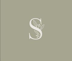 the letter s is made up of leaves and branches, as well as an initial