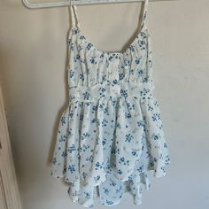 Beautiful Little Too With Spaghetti Straps, Back Opens Into A Nice Open Back. Cute White Tank Top With Floral Print, Cute Floral Print Camisole With Spaghetti Straps, Blue Spaghetti Strap Camisole For Day Out, Cute Floral Print Tank Top For Day Out, Cute White Spring Camisole, Blue Summer Style Camisole For Spring, Cute White Camisole With Spaghetti Straps, White Floral Print Camisole For Vacation, Blue Floral Print Camisole For Summer