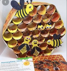 the book is open to reveal an image of bees and honeycombs with holes in them