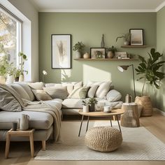 a living room with green walls and white furniture