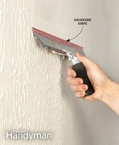 a person using a paint roller on a wall with the words squeege prime