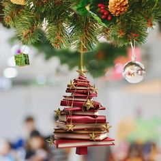 a small christmas tree made out of books