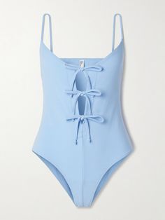 Lisa Marie Fernandez’s swimsuit is defined by a trio of ties through the front - adjust them to cinch the shape and coverage. It's made from stretchy crepe in a serene blue and has slim shoulder straps. Style it off the beach with high-rise jeans.