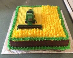 a cake that is shaped like a farm tractor