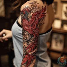 a woman with a red bird tattoo on her arm