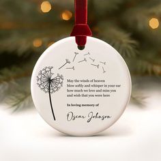 a christmas ornament with a dandelion on it