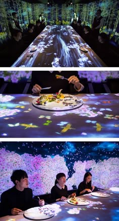 two people sitting at a table with food in front of them and projected on the floor