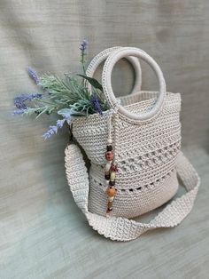 Handcrafted Minimalist Woven Shoulder Bag.     Dimensions: 11in wide x 9in high -  (28cm wide x 21 cm high)      Material: Natural cotton     Strap Length: 34in (87 cm) Care Instructions:     Gently clean with a toothbrush and mild soap or toothpaste     Avoid machine washing, bleaching, and ironing Handwoven Crochet Bucket Bag For Everyday Use, Beige Bohemian Crochet Bag With Handles, Bohemian Beige Crochet Bag With Handles, Bohemian Beige Crochet Bag, Everyday Bohemian Handheld Bucket Bag, Everyday Handheld Woven Bucket Bag, Bohemian Crochet Bag With Double Handle For Everyday, Everyday Bohemian Crochet Bag With Adjustable Strap, Cream Crochet Bag With Open Weave