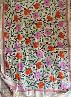 "Multicolored flowers Hand Embroidered Kantha Stitch Silk Dupatta | Semi Tussar Silk Dupatta | Silk Shawls for Weddings | Kantha Dupatta Heavy work full length kantha stitch silk dupatta for parties and weddings All photographs are of original products, exclusive single pieces are available only. LENGTH 2.5 MTR WIDTH 36 INCH PLEASE DRY CLEAN ONLY. SLIGHT DIFFERENCE IN SHADE MIGHT APPEAR DUE TO CAMERA & DAY LIGHTS. PLEASE CHERISH THE LITTLE IMPERFECTIONS, CREATED BY OUR TEAM WITH LOVE\"	in stock Festive Orange Dupatta With Floral Embroidery, Traditional Wear With Floral Embroidery, Multicolor Chikankari Embroidered Fabric For Festivals, Multicolor Floral Embroidered Fabric For Wedding, Multicolor Floral Embroidered Fabric, Festival Multicolor Chikankari Embroidered Fabric, Traditional Multicolor Floral Embroidered Dupatta, Multicolor Floral Embroidered Saree, Multicolor Floral Embroidered Dupatta For Diwali