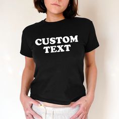 Custom Text Baby Tee, Aesthetic Tee, Women's Fitted Tee, Unisex Shirt, Trendy Top, Y2K Gift for Her, Personalized Retro 90s Style The first model is wearing a Baby Tee XS size. DETAILS - 100% cotton (fiber content may vary for different colors) - tear-away label  SIZING Sizes vary by shirt style. Please check the size chart before making your purchase. PLEASE NOTE: Our Baby tee is sized for a youth, reminiscent of the '90s-era shrunken-down T-shirt. This style, popularized by the skater/raver cu Baby Tee Aesthetic, Custom T Shirt Printing, 90s Era, Trendy Top, Fitted Tee, Baby T Shirts, 90s Style, Retro 90s, Baby Prints