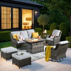 an outdoor living area with furniture and lighting