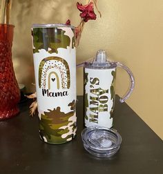 two tumblers sitting next to each other on a table