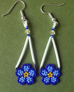 blue and yellow flower beaded earrings on white earwires hanging from hook hooks