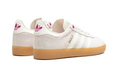 The Women’s adidas Gazelle “Valentine’s Day” is a women’s-exclusive colorway of the retro indoor shoe inspired by the February holiday.  With pink accents and a heart-shaped top eyelet, the adidas Gazelle “Valentine’s Day” undoubtedly nods to the lover’s holiday.  The upper is complete with a Putty Mauve-colored suede construction and white leather Three Stripes on the sides.  A gold “Gazelle” logo appears on the lateral side, while a Pink Fusion adidas Trefoil logo is seen on the white leather Gazelles Adidas, Adidas Shoes Gazelle, Adidas Gazelle Women, 2024 Shoes, Bar Shoes, Adidas Trefoil