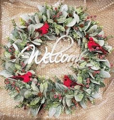 a wreath with the word welcome written on it