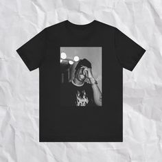 Y2K | Travis Scott T-Shirt | Aesthetic | Trendy | Fan Gifts | Travis Scott Merch | Vintage  Such a cute design and the material is soft on the inside and out! Made of 90% cotton, and 10% polyester. All sizes are unisex and true to size. Please order a size up for an oversized fit. Thank you for looking at this listing and shopping with us, please contact us with any questions or concerns but please read full listing details prior ♥ TO CARE FOR YOUR SHIRT 1. Wash Inside Out in Cold Water 2. Hang Dry OR Dry on Low Heat * DO NOT Iron OR Dry Clean Thank you! ♥ Front Print T-shirt For Streetwear, Unisex Trendy Streetwear T-shirt, Y2k Style Black T-shirt For Streetwear, Y2k Style Black Pre-shrunk T-shirt, Black Y2k Style T-shirt For Streetwear, Y2k Black Pre-shrunk T-shirt, Y2k Unisex T-shirt For Streetwear, Unisex Y2k T-shirt For Streetwear, Black Y2k T-shirt For Streetwear