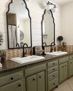 a bathroom with two sinks and mirrors on the wall next to each other in it