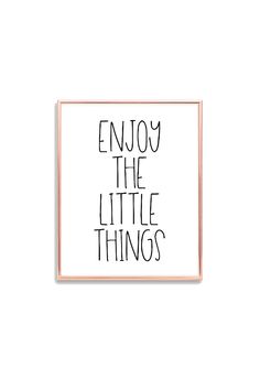 the words enjoy the little things written in black ink on a white background with a pink frame