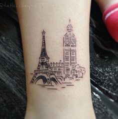 a small tattoo with the eiffel tower on it