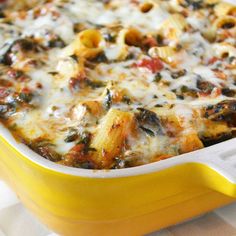 a yellow casserole dish filled with pasta and cheese