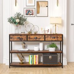 a shelf with some books on top of it next to a wall filled with pictures