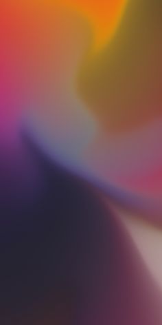 blurry image of an orange, yellow and pink background with the colors being added