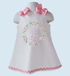 Beautiful A-line/Jumper dress with your little girl Initial or Age embroider. Initial or Age embroider design. Dress is done in a white cotton fabric.  The dress closes in the at shoulder with buttons, bows are pinned at shoulder for an easy removal. Bodice fully lined, we finish all seams with a serger for a professional look and long lasting. All our items are handmade and made to order. If your order needs to be done and ship before my turnaround ( ship date in your order ) please mention date needed in Notes To Seller. We recommend washing inside out on gentle cycle and hang to dry or low heat. Do not use bleach. Iron inside out on low heat. Created in a smoke free studio. If any question please do not hesitate to contact us. Cute Floral Applique Dress For Birthday, Floral Applique Dress For Summer Birthday, Sleeveless Floral Applique Dress For Birthday, Sleeveless Dress With Floral Applique For Birthday, Sleeveless Floral Embroidered Baptism Dress, White Cotton Dress For Birthday, Cute Embroidered White Dresses, Cute White Embroidered Dresses, Cute White Dress With Embroidered Hem