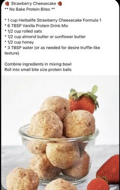 the ingredients for strawberry cheesecake bites in a glass bowl with strawberries on top