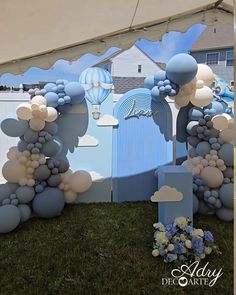 an outdoor event with balloons and decorations