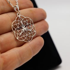 Embrace the beauty of sacred geometry with the Flower of Life 925 Sterling Silver Necklace. This elegant necklace features the ancient and powerful Flower of Life symbol, representing the interconnectedness of life and the universe. Crafted from high-quality 925 sterling silver, this pendant serves as a talisman of unity, spiritual growth, and balance. Material: 925 Sterling Silver Pendant Diameter: 3.2 cm (1.2 inches) Chain Lengths Available: 40 cm (15.7 inches), 45 cm (17.7 inches), 50 cm (19. Merkaba Necklace, Victory Symbol, Flower Of Life Symbol, Silver Necklace For Women, Ankh Necklace, Women Day, Clover Necklace, Spiritual Gifts, Cool Necklaces