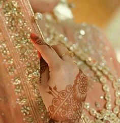 a woman with henna on her hand