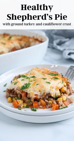 healthy shepherd's pie with ground turkey and cauliflower crust on a white plate