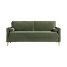 a green couch sitting on top of a white floor