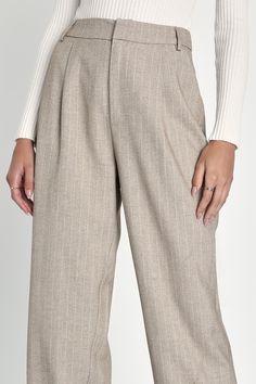 Everyone will take notice when you walk in wearing the Lulus Professionally Posh Beige and White Pinstriped Wide-Leg Pants! Midweight woven fabric, with pinstripes throughout, shapes these pants that have a high waist, belt loops, and front diagonal pockets. Back boasts two decorative welt pockets, atop wide legs that fall to ankle-grazing hems. Hidden zip fly with top clasp closure. Fit: This garment fits true to size. Length: Ankle length. Size medium Inseam: 29.00 Front Rise: 13.00 Waist: Fit Straight Pants With Vertical Stripes For Business Casual, Chic Striped Tapered Leg Pants, Striped Ankle-length Pants For Work, Striped High-waisted Pants For Work, Classic Tapered Leg Bottoms With Vertical Stripes, Business Casual Ankle-length Pants With Vertical Stripes, Classic Straight Pants With Vertical Stripes, Fall Workwear Bottoms With Vertical Stripes, Striped Tapered Leg Bottoms For Work