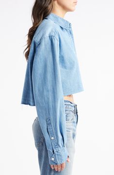 Channel down-home style in this cropped Japanese chambray shirt that has a lighter wash swiped across the back. 17" length Front button closure Point collar Long sleeves with button cuffs Chest patch pocket 100% cotton Machine wash, line dry Imported Cropped Cotton Denim Top With Button Closure, Trendy Cropped Shirt For Spring, Cropped Cotton Denim Top For Fall, Casual Relaxed Fit Cropped Shirt, Medium Wash Cropped Denim Top In Relaxed Fit, Medium Wash Cropped Denim Top Relaxed Fit, Cropped Medium Wash Denim Top With Relaxed Fit, Spring Blue Cropped Shirt With Relaxed Fit, Blue Relaxed Fit Cropped Shirt For Spring