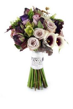 a bouquet of flowers sitting on top of a white table