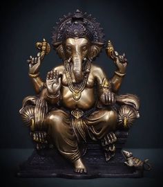 an elephant statue sitting on top of a table