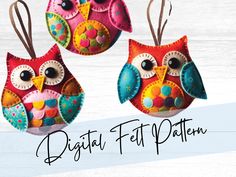 three colorful owl ornaments hanging from strings on a white wooden background with the words digital felt pattern