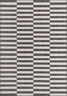 a black and white striped rug with vertical lines