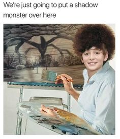 a woman holding a brush and painting on an easel with the caption, we're just going to put a shadow monster over here