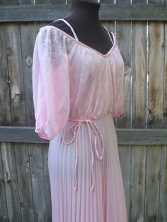 "Vintage 1970s pale pink off the shoulder pleated Charlies Angel's style dress.  Open slits down elbow length sleeves, simple tie around waist, long zipper down the back with hook and eye closure at the top.  A fun dress with some strappy heels for your next summer party.  A fantastic vintage find! Label: Union Made in the U.S. A.              Size 9/10 Bust: 36 - 38\" Underneath bust(where the tie ties) 30\" Hips: free Length: 53\" zipper up the back is 15 inches long The tag inside only says union made in the USA dry clean only, but my best guess is that it is polyester Excellent vintage condition Please convo me with any questions. Follow me on Instagram@charlotteswish" Pink Summer Dress, Rose Pale, Fun Dress, Vintage Wardrobe, 60 Fashion, Union Made, Elbow Length Sleeve, Strappy Heels, Vintage 1970s