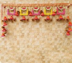 an overhead view of a wall decorated with bells and garlands on the top of it