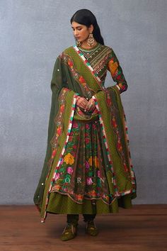 Olive green full sleeves anarkali with all over gullista digital print and gota lace, heart charms and metallic coins hand embroidery on the yoke. Paired with a churidar and a hand embroidered-printed matching dupatta with multi thread tassels border detailing. - Aza Fashions Anarkali Green Choli For Navratri, Green Embroidered Anarkali Set For Navratri, Green Embroidered Anarkali Set For Festivals, Multicolor Long Sleeve Anarkali Set With Mirror Work, Bollywood Style Lehenga With Long Sleeves In Pista Green, Bollywood Style Pista Green Lehenga With Long Sleeves, Bollywood Green Anarkali Set For Navratri, Navratri Pista Green Long Sleeve Sharara, Pista Green Long Sleeve Sharara For Navratri